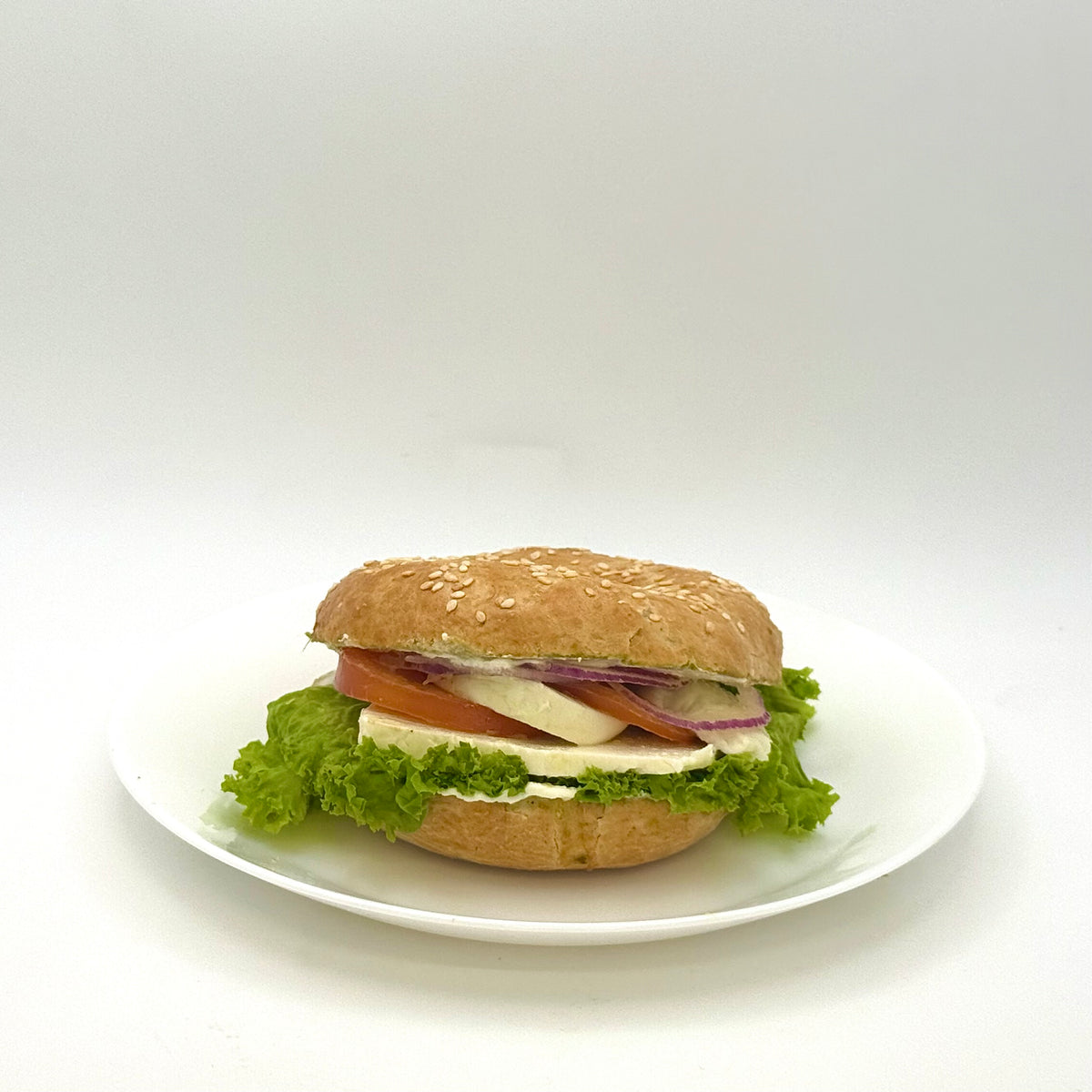 Sesame bagel with three cheeses