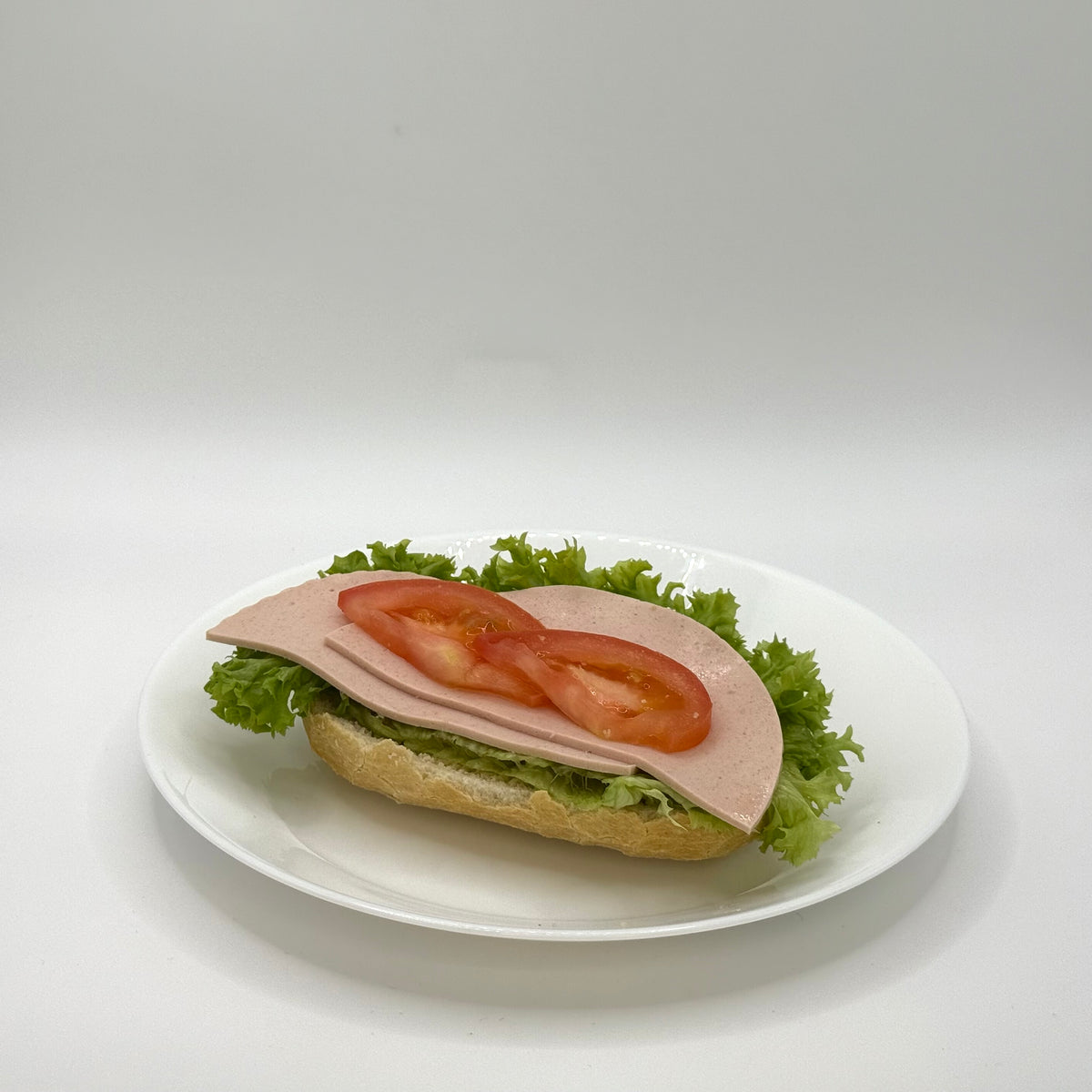 half a filled wheat roll with turkey breast 