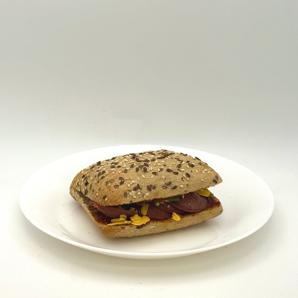 multigrain roll topped with sucuk 