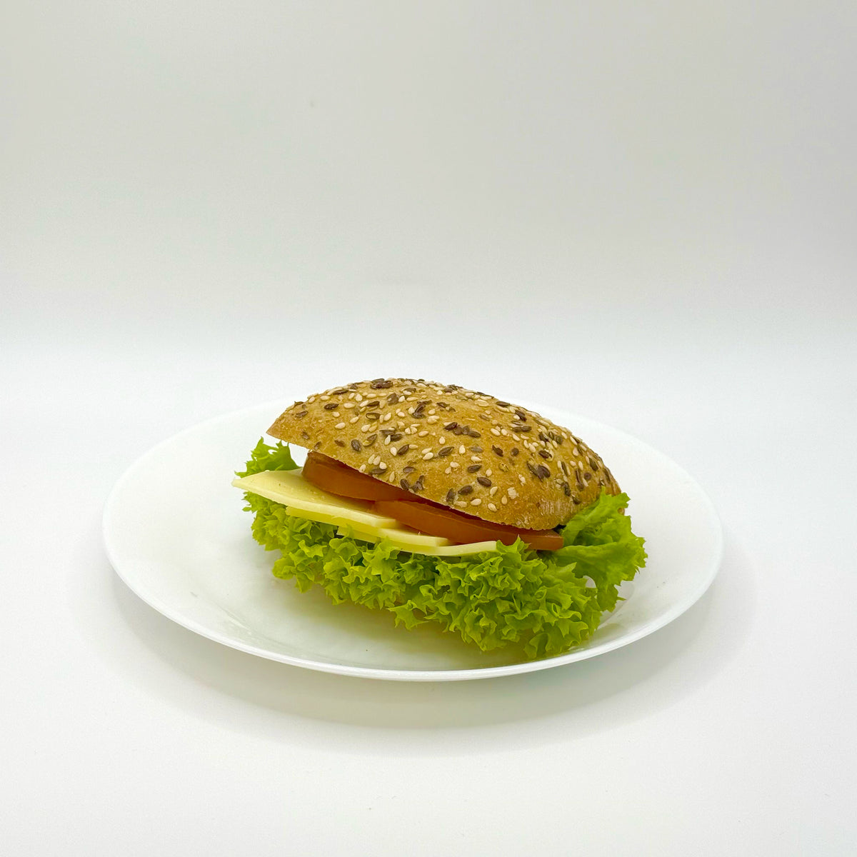 Multigrain roll topped with Gouda cheese 